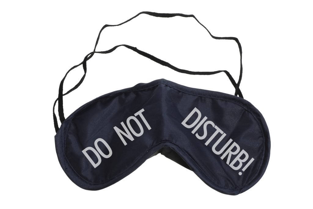 Do not Disturb eye ware helping people rest their eyes and sleep in bright light areas.